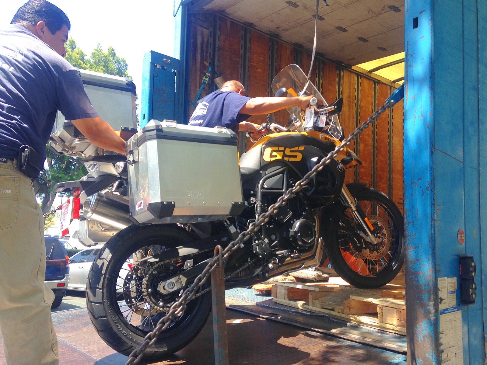 The BMW F800 GS being unloaded from a shipping container