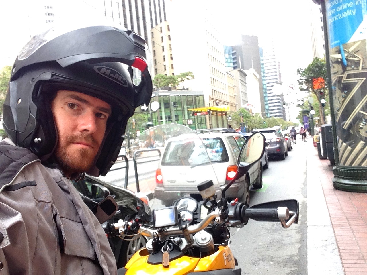 A helmet selfie in downtown San Francisco traffic