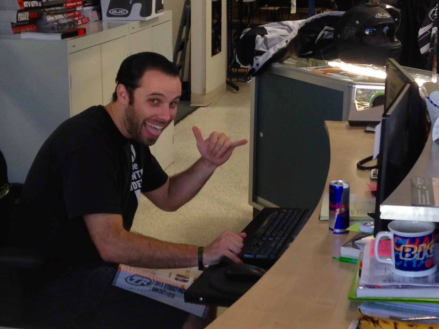 Jason at the counter of the motorcycle shop