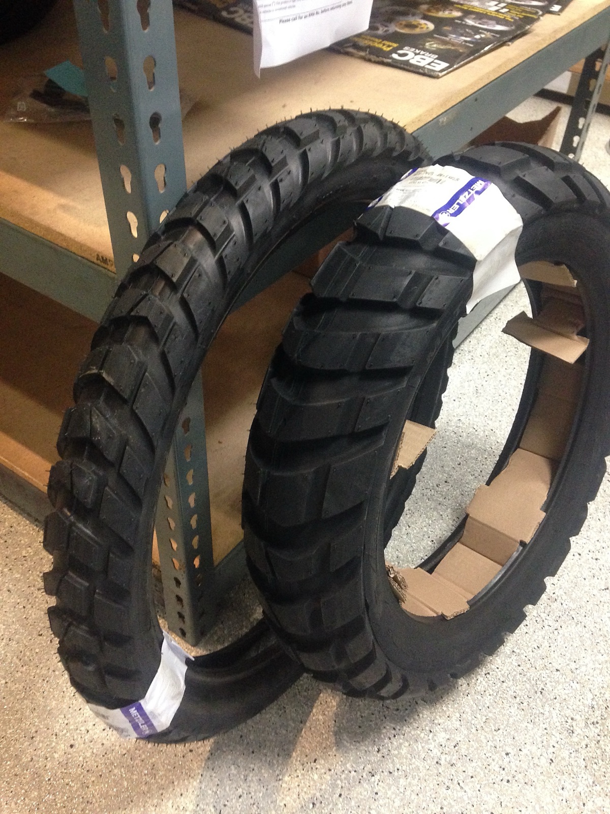 A pair of new knobbly motorcycle tyres