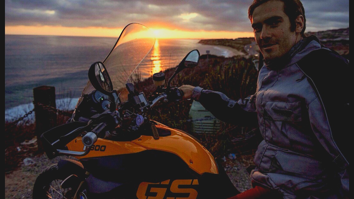 The motorcycle at sunset above the Pacific