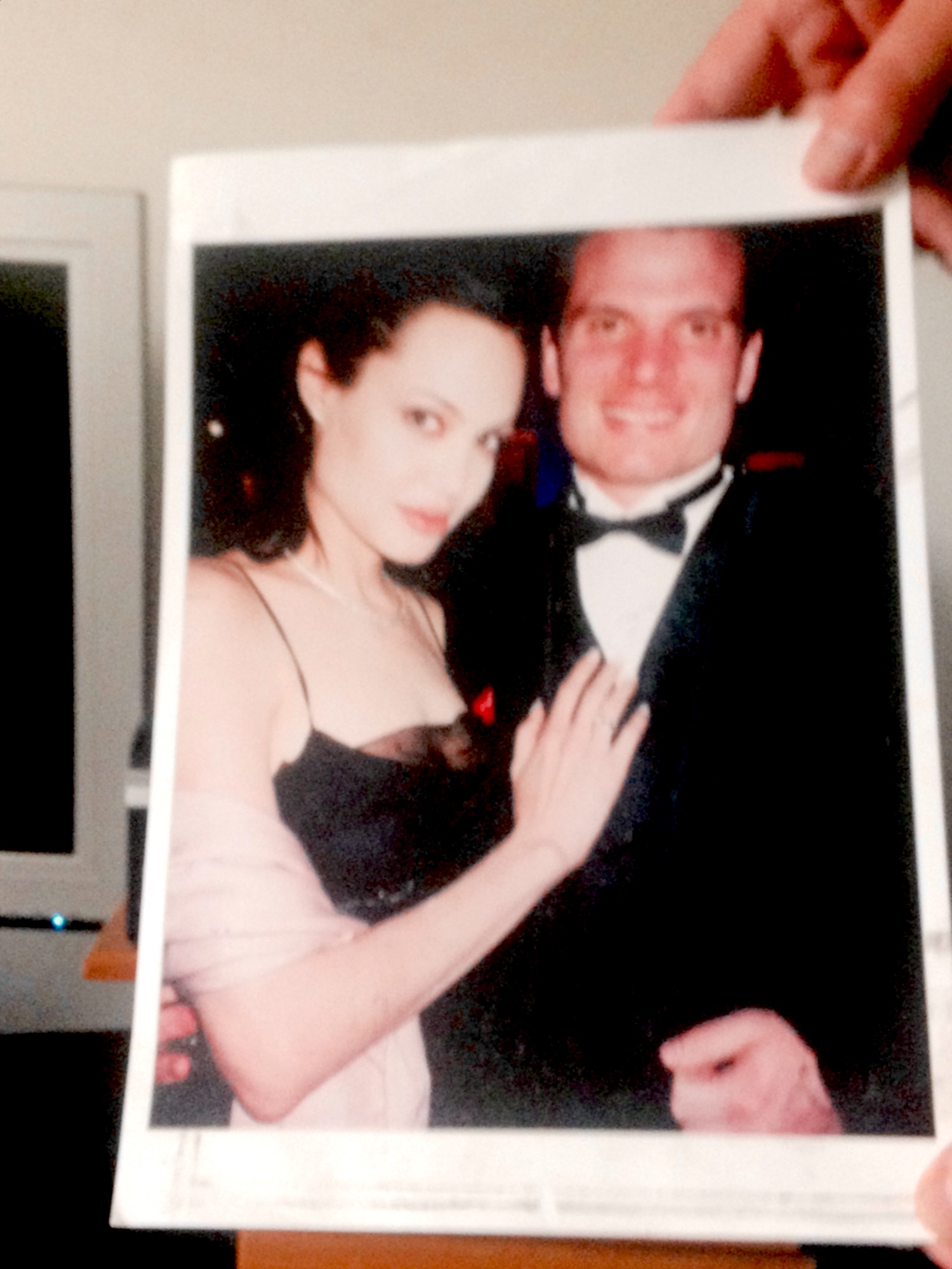 A framed photograph of the host with Angelina Jolie