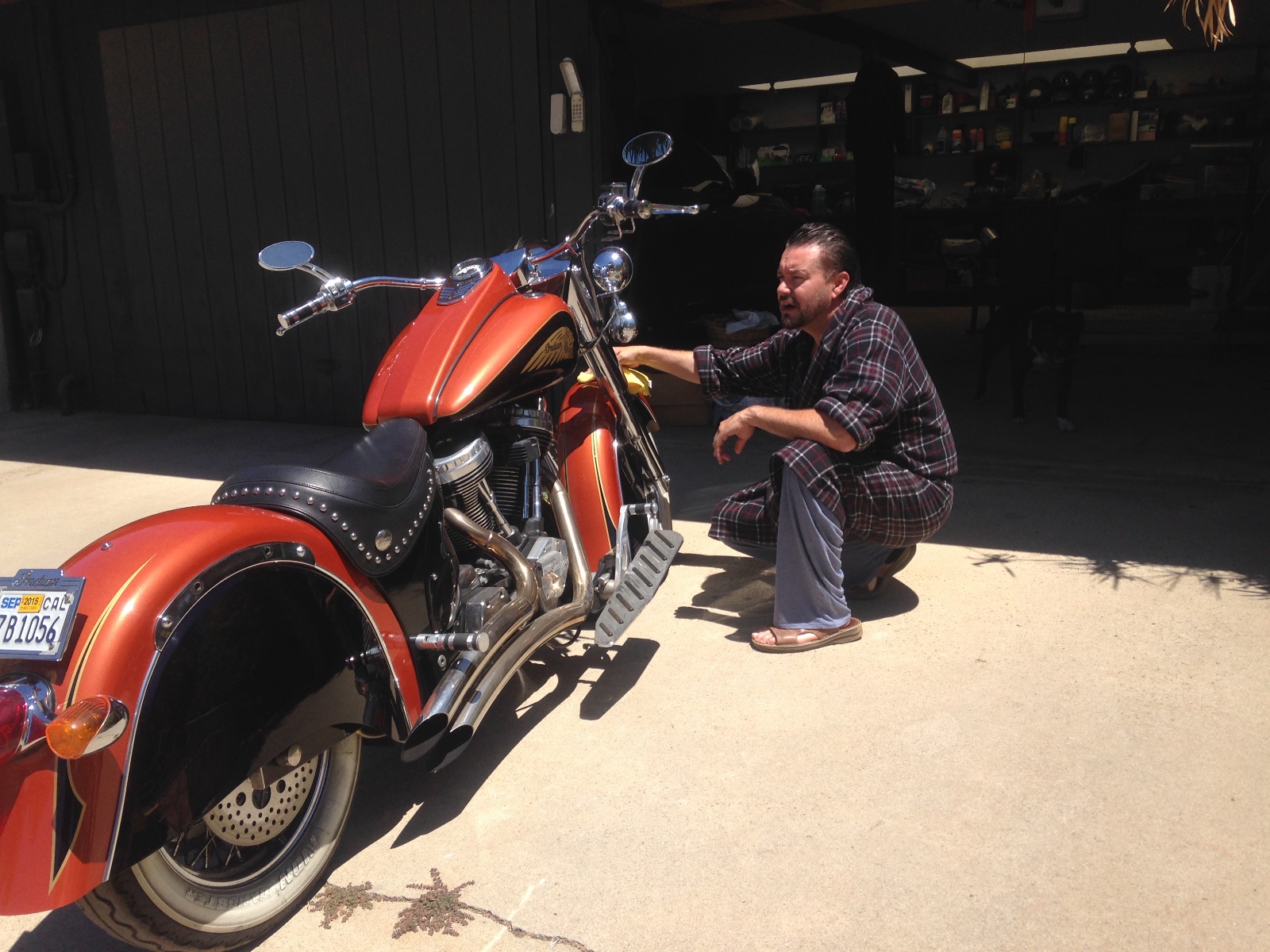 A new orange Indian motorcycle being polished