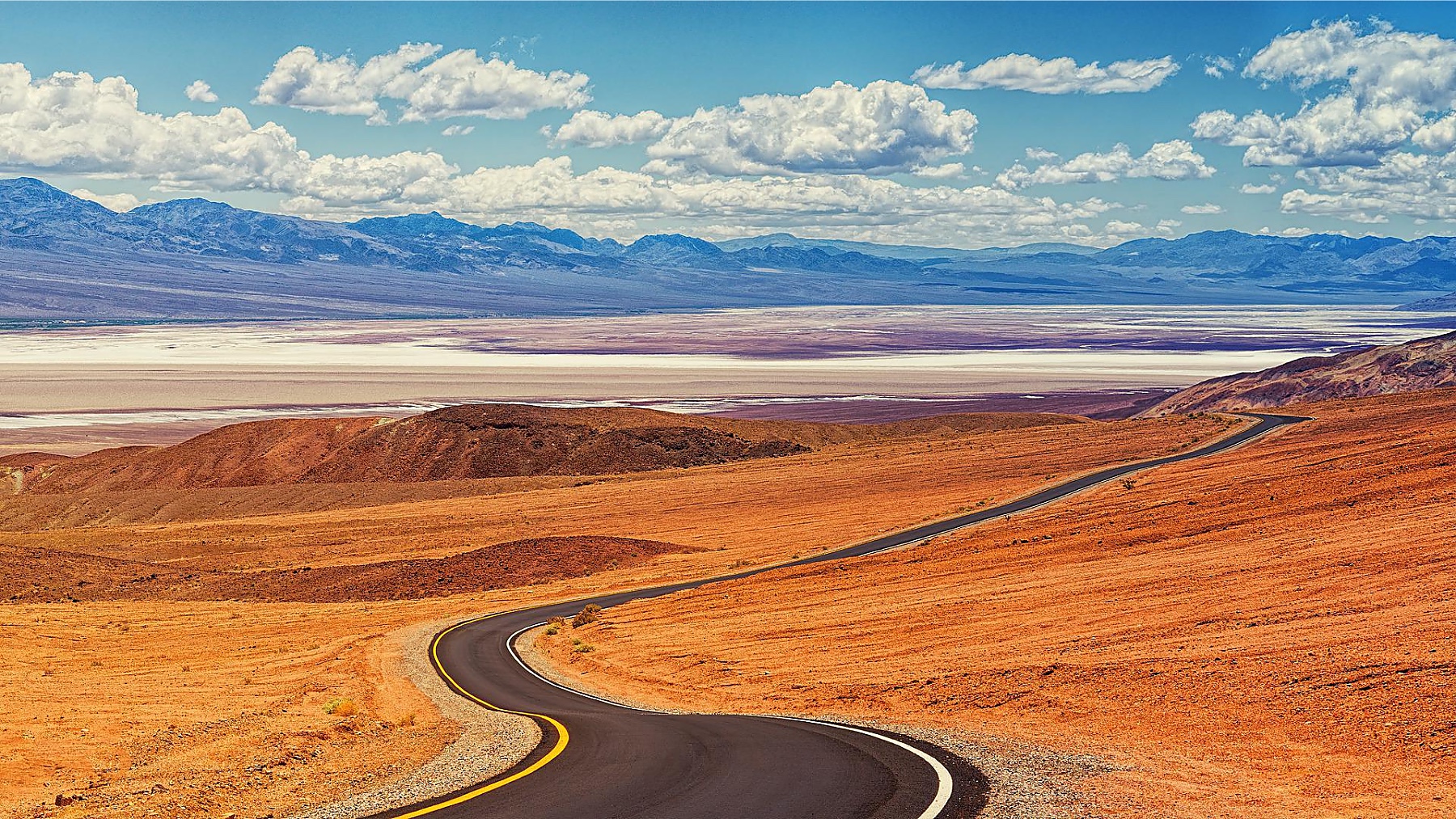 A road curving above the salt flats of Death Valley