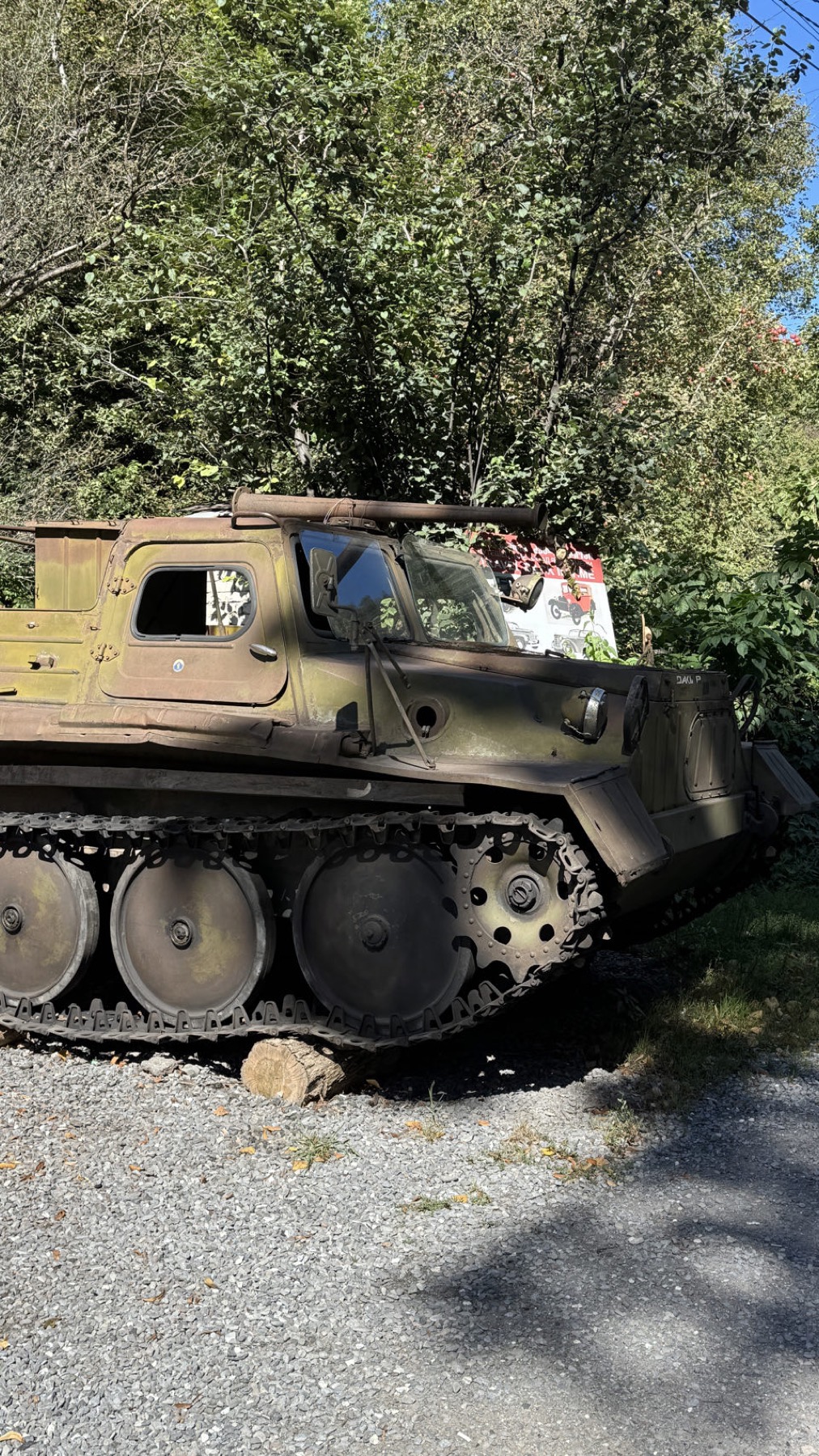 An abandoned armoured vehicle beside the road