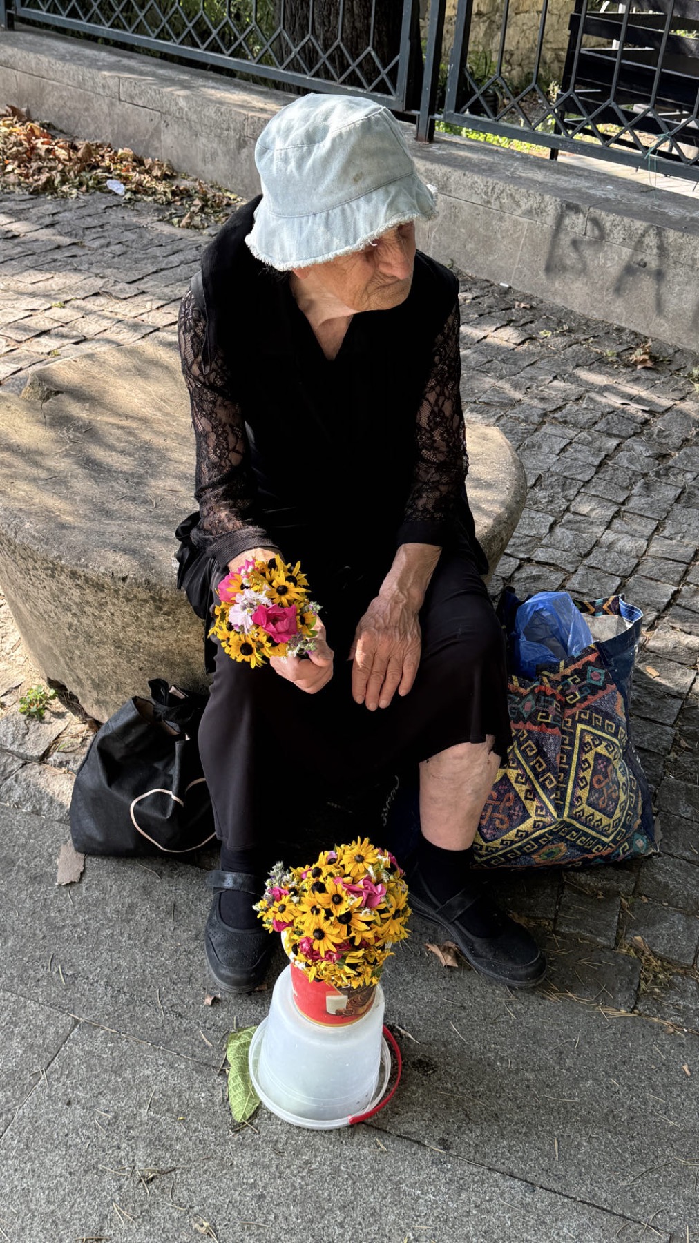 A woman selling flowers in the street