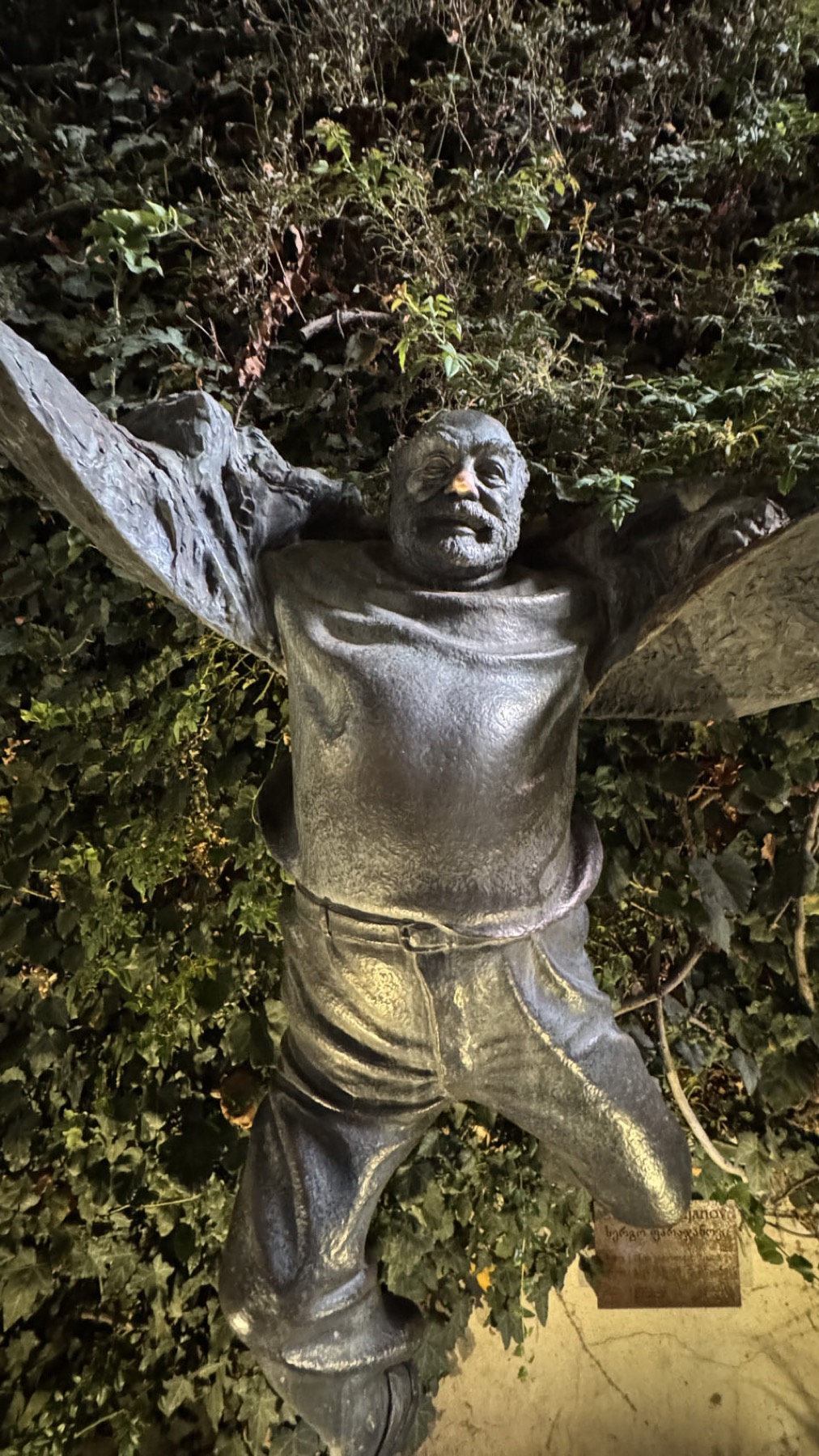 A Soviet era statue among the trees