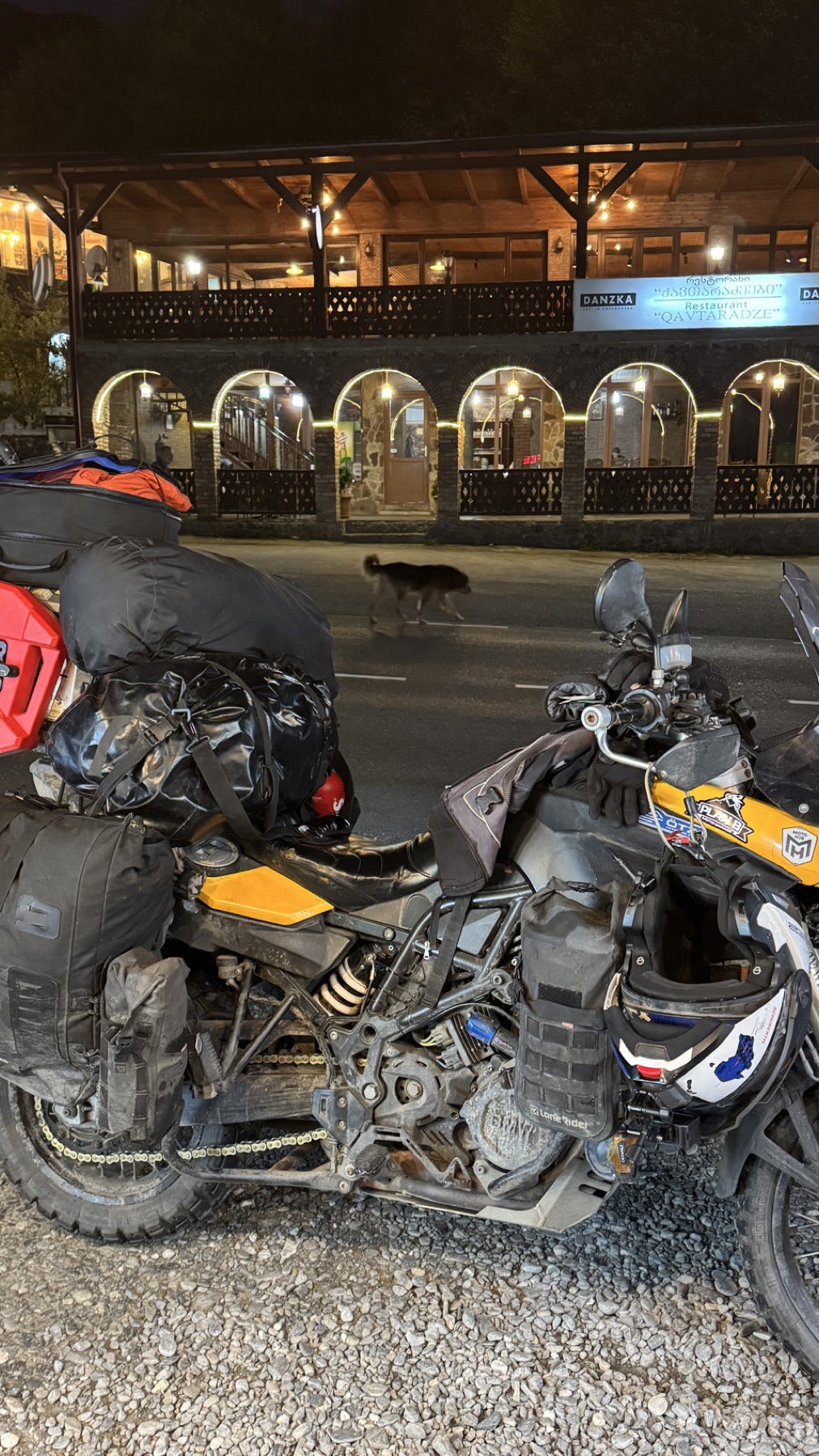 Two motorcycles parked at night
