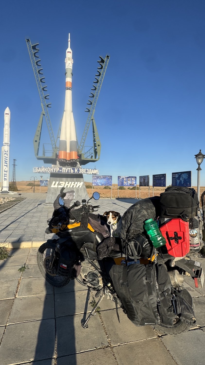 The loaded motorcycle with Jacko on it in front of the rocket monument
