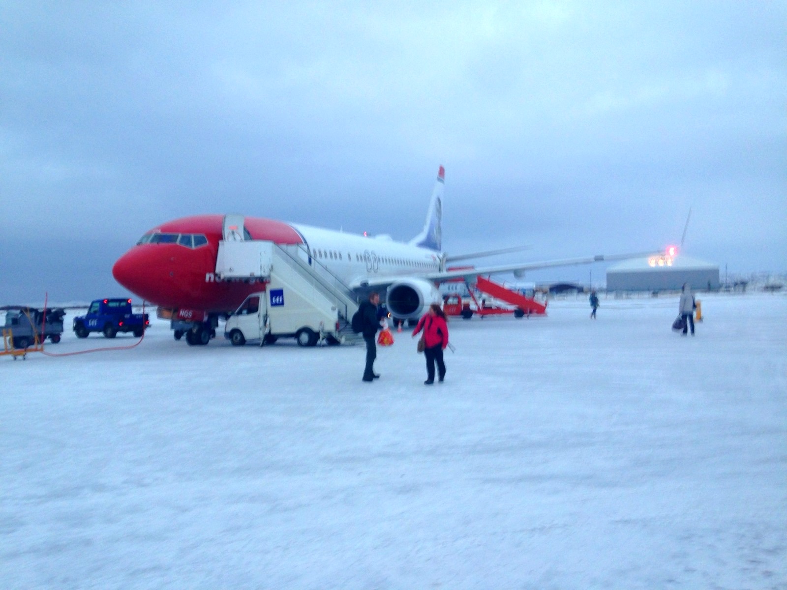 A Norwegian aircraft on the snowy apron at Kirkenes