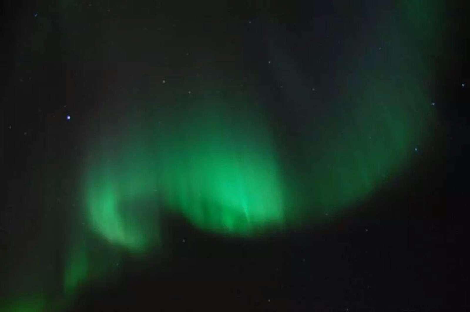 A green aurora photographed on a phone in 2014
