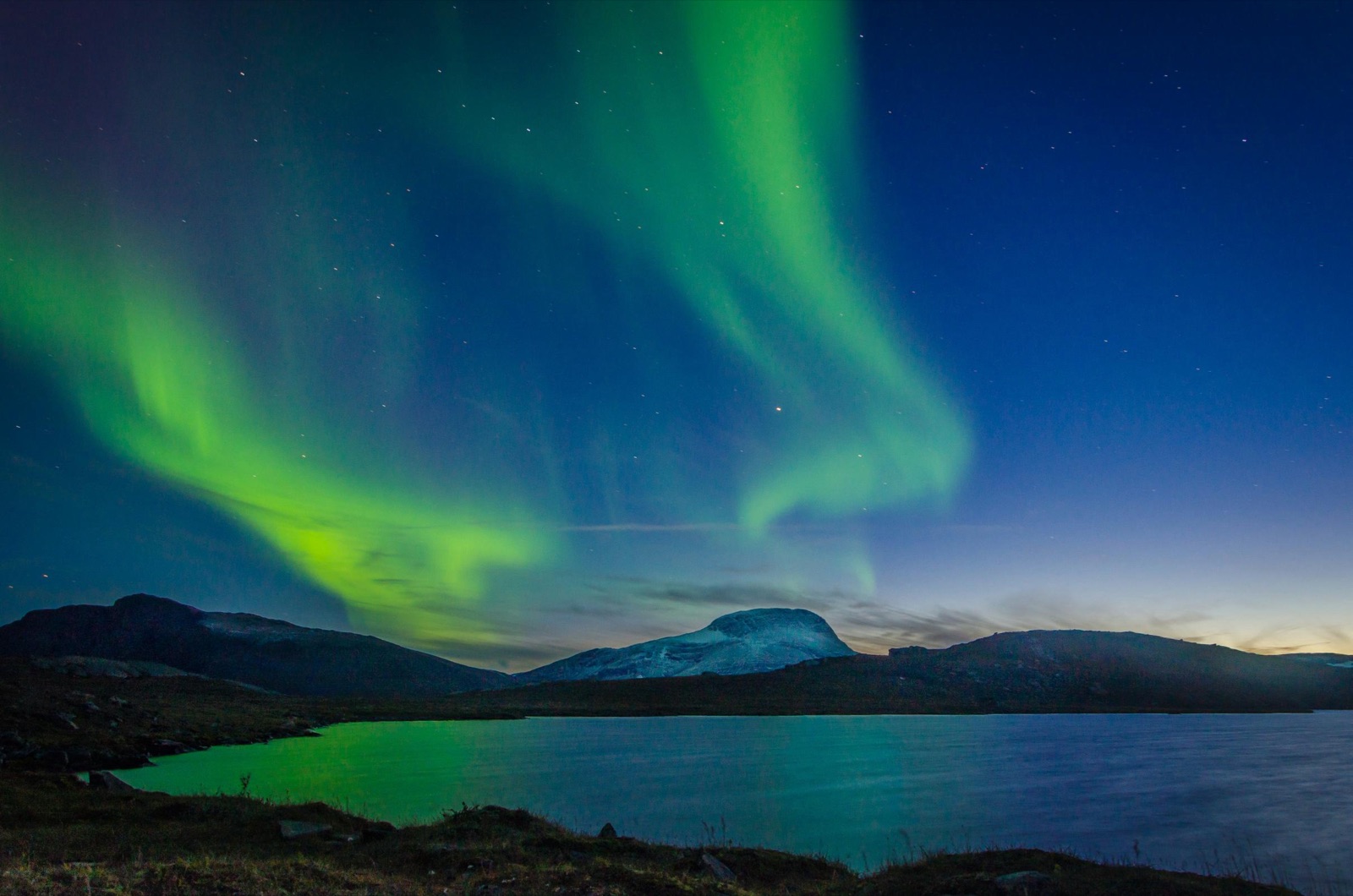 The northern lights over a lake