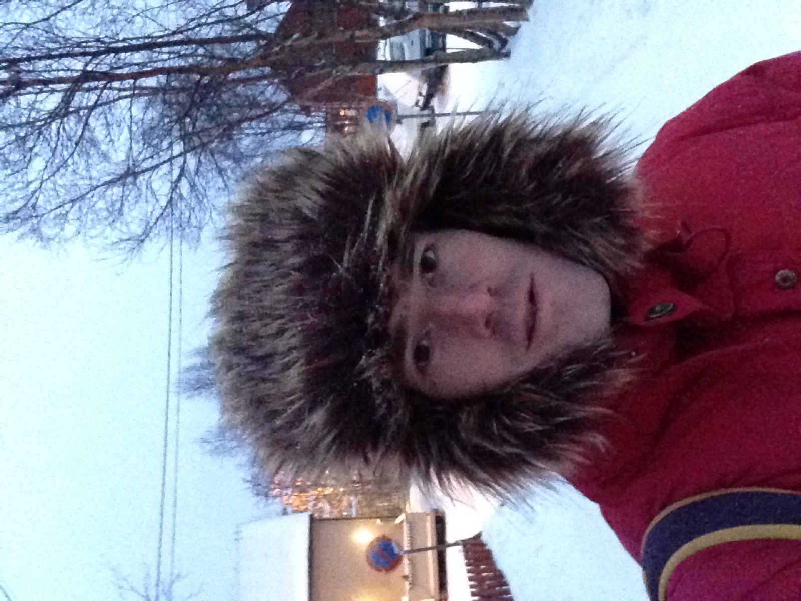 Rodrigo in a fur hat on a snowy street