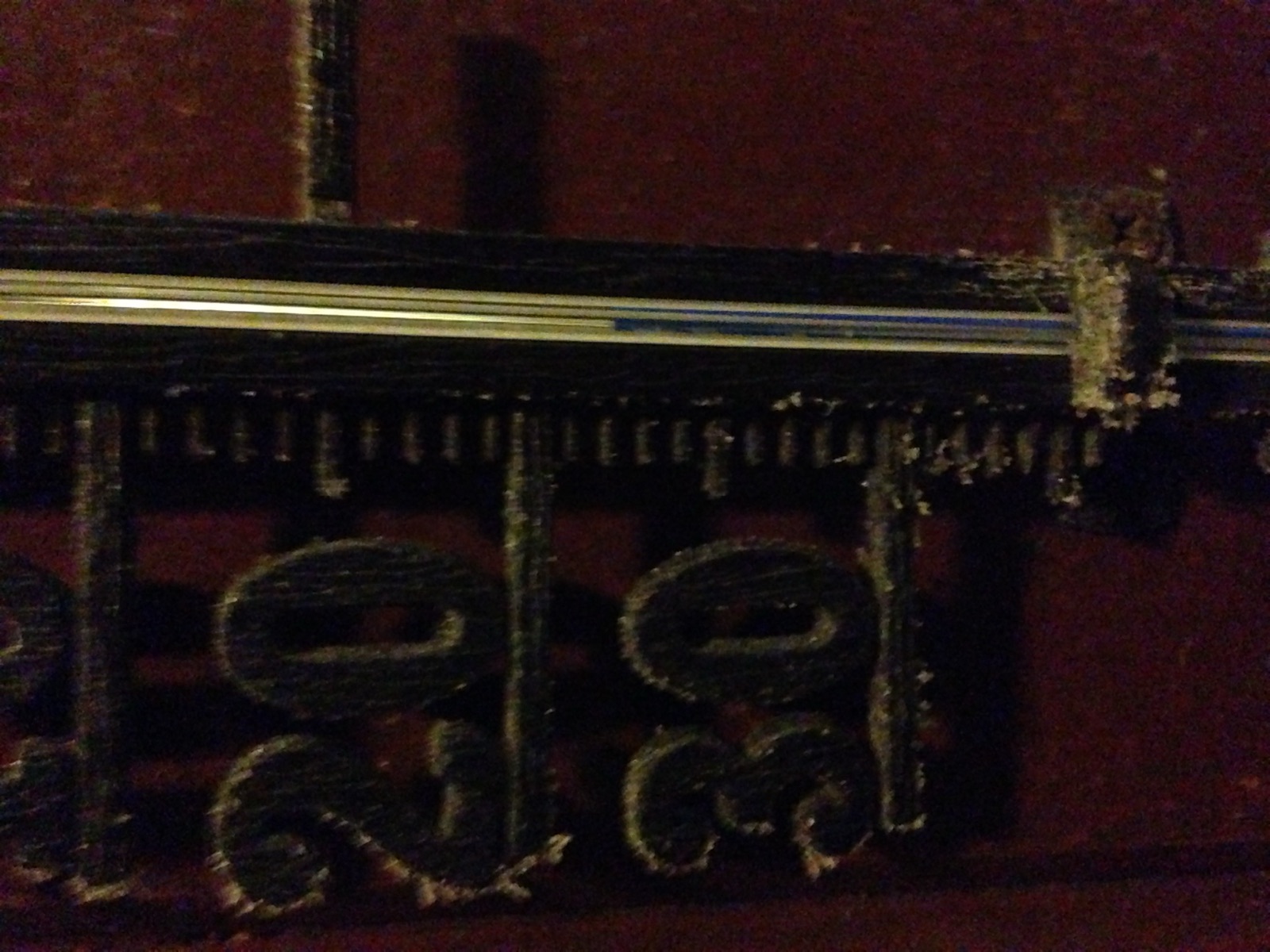 A frost-covered thermometer on a wall