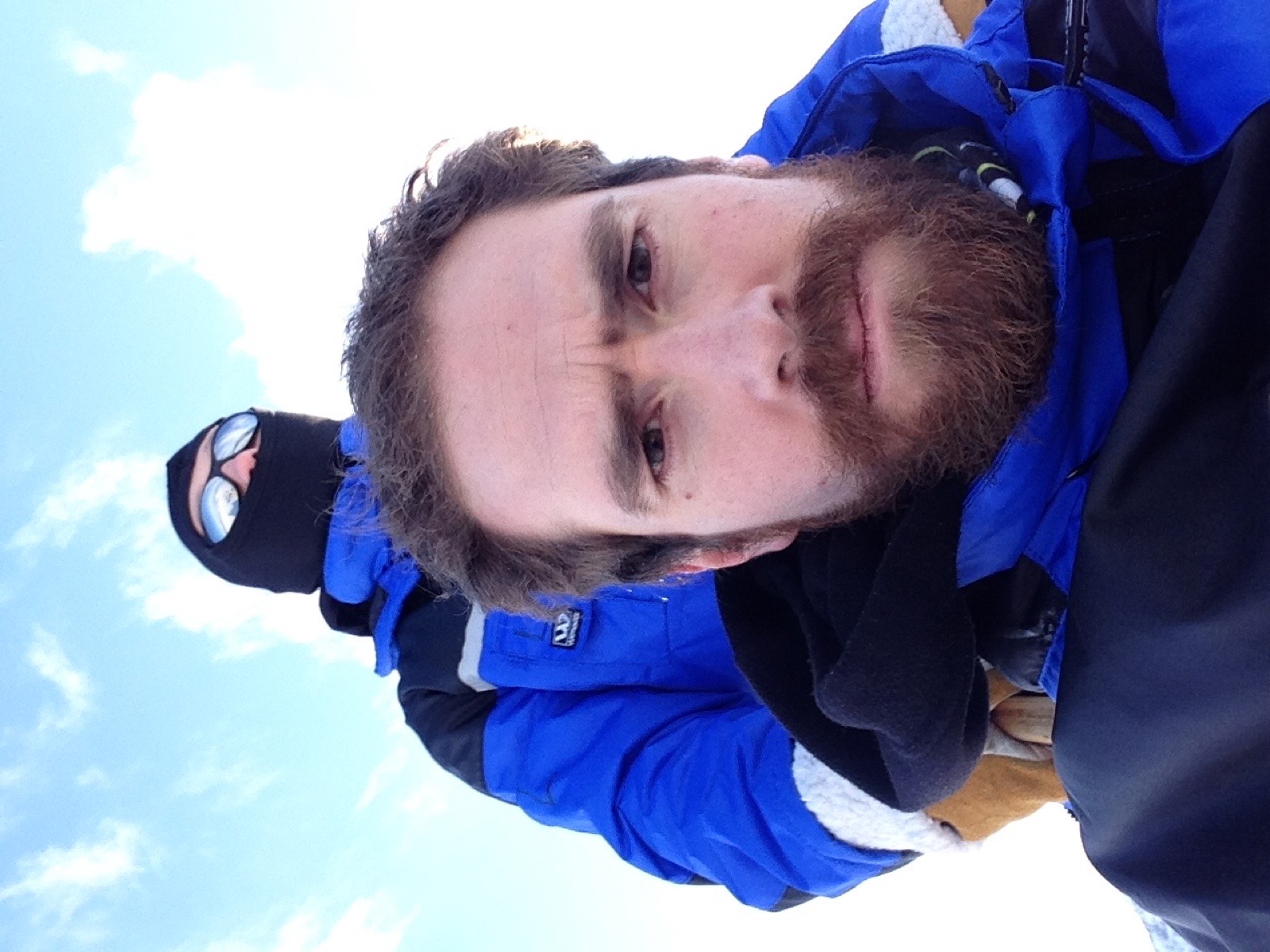 A selfie on the sled with the musher behind