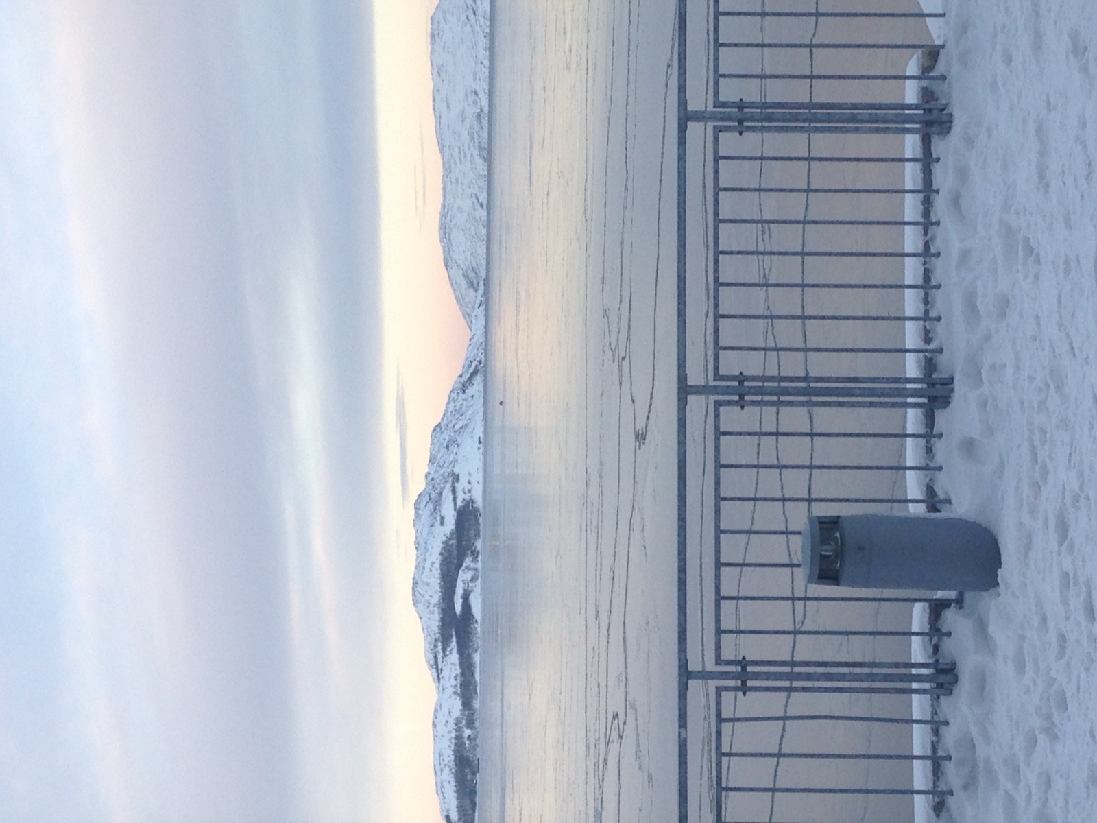 The fjord with pack ice at sunset
