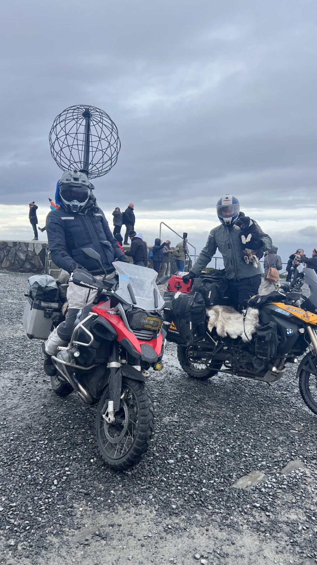 The two motorcycles with the northern sea behind