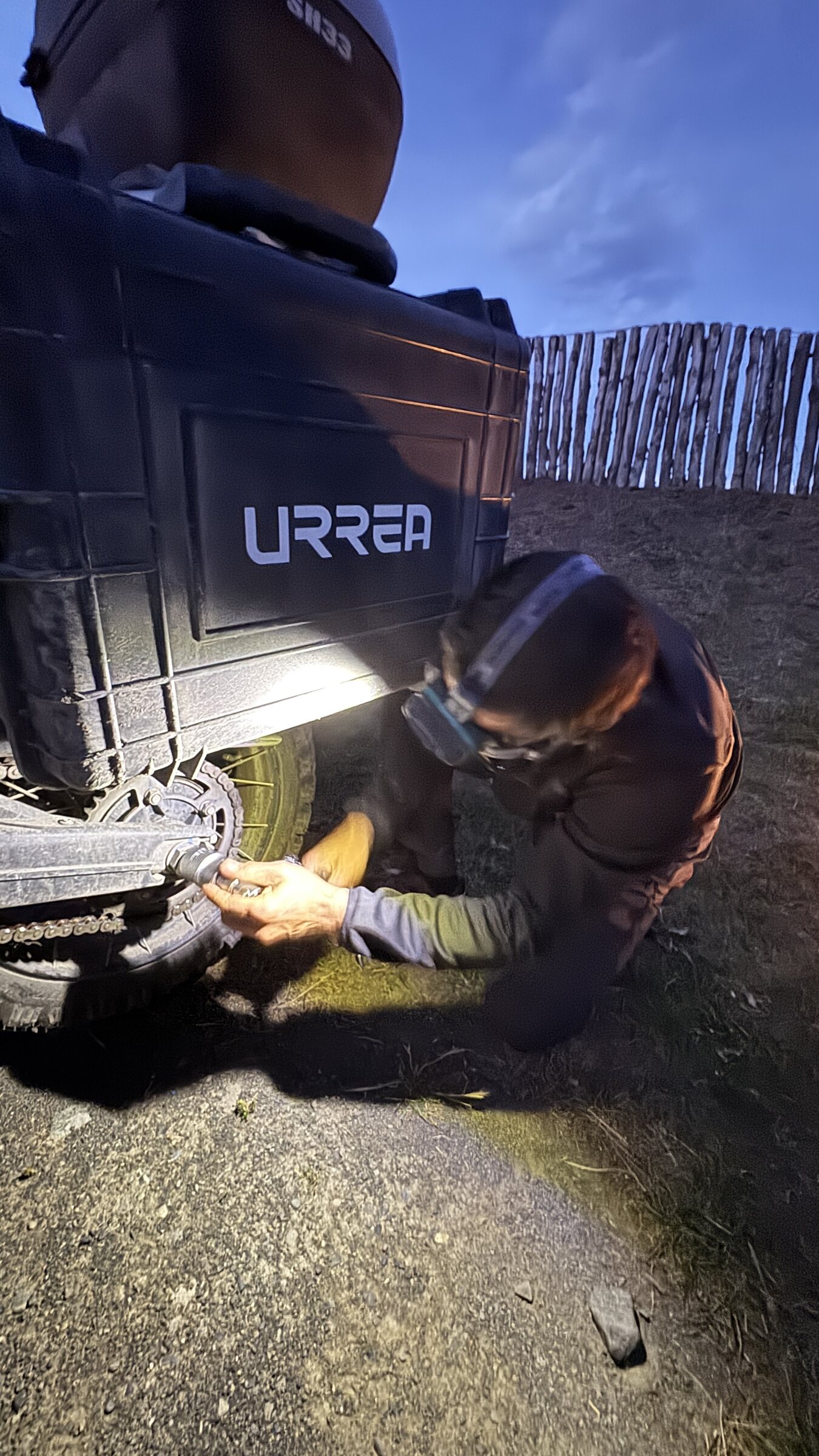 Mechanical work beside an expedition motorcycle in Patagonia