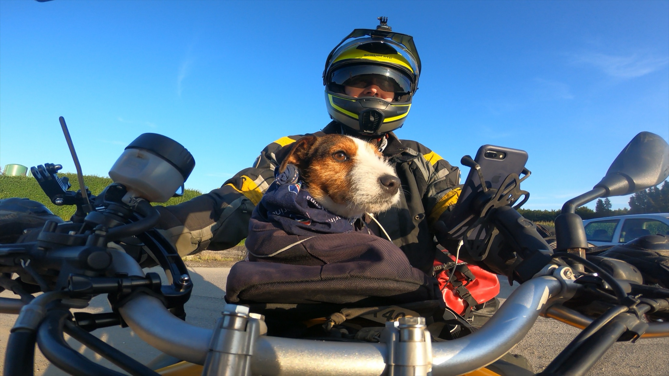 Rodrigo in his helmet with Jacko riding in the tank bag in front of him