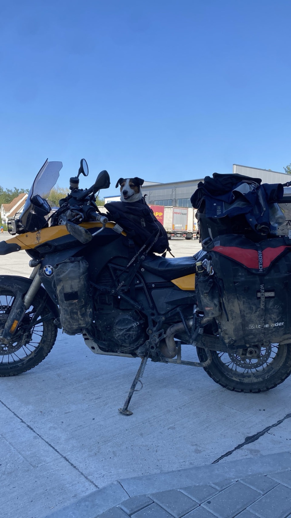 The loaded motorcycle at the Albita border post with Jacko sitting on the seat