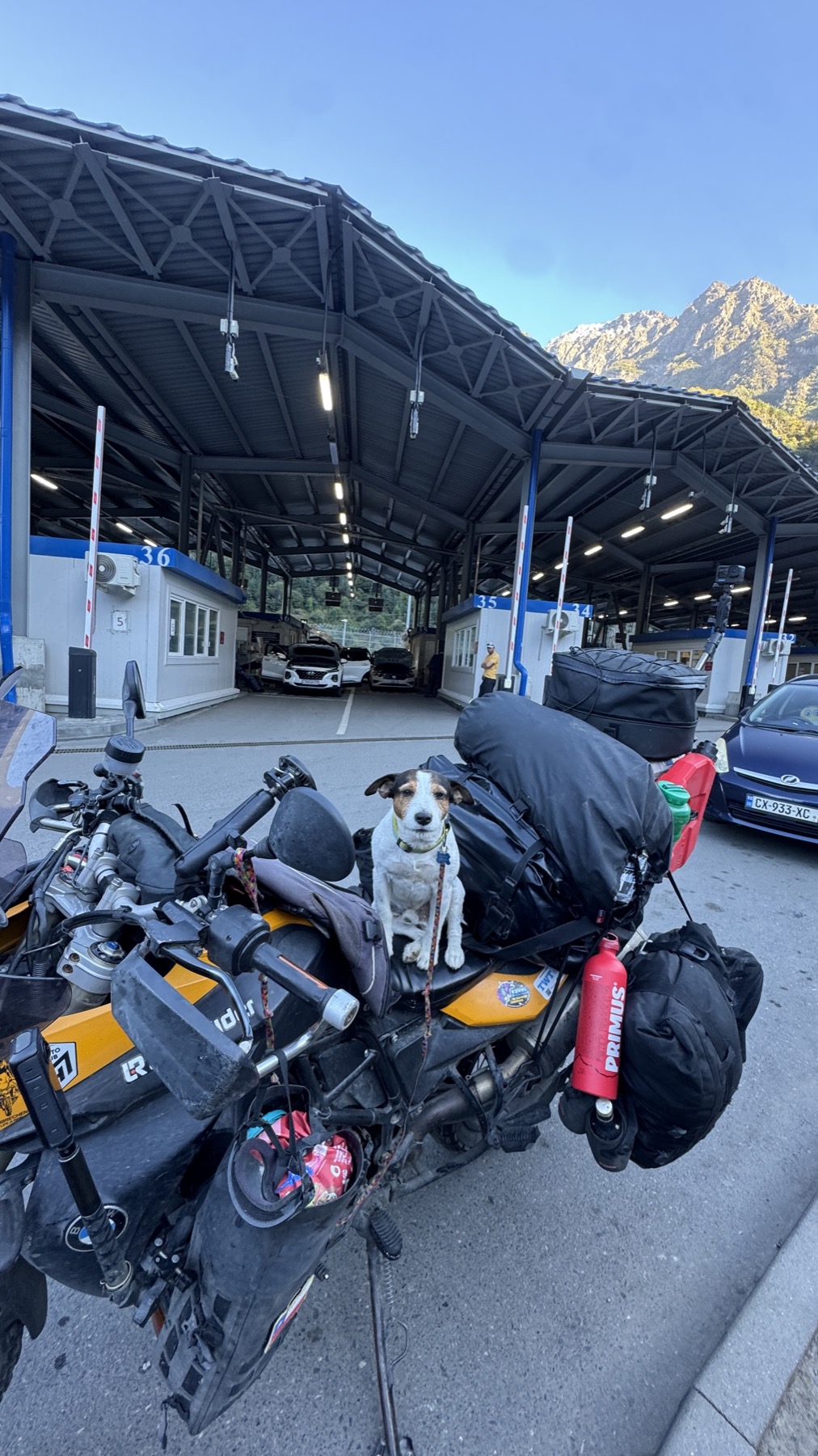 Jacko sitting on the loaded motorcycle inside the Russian customs hall