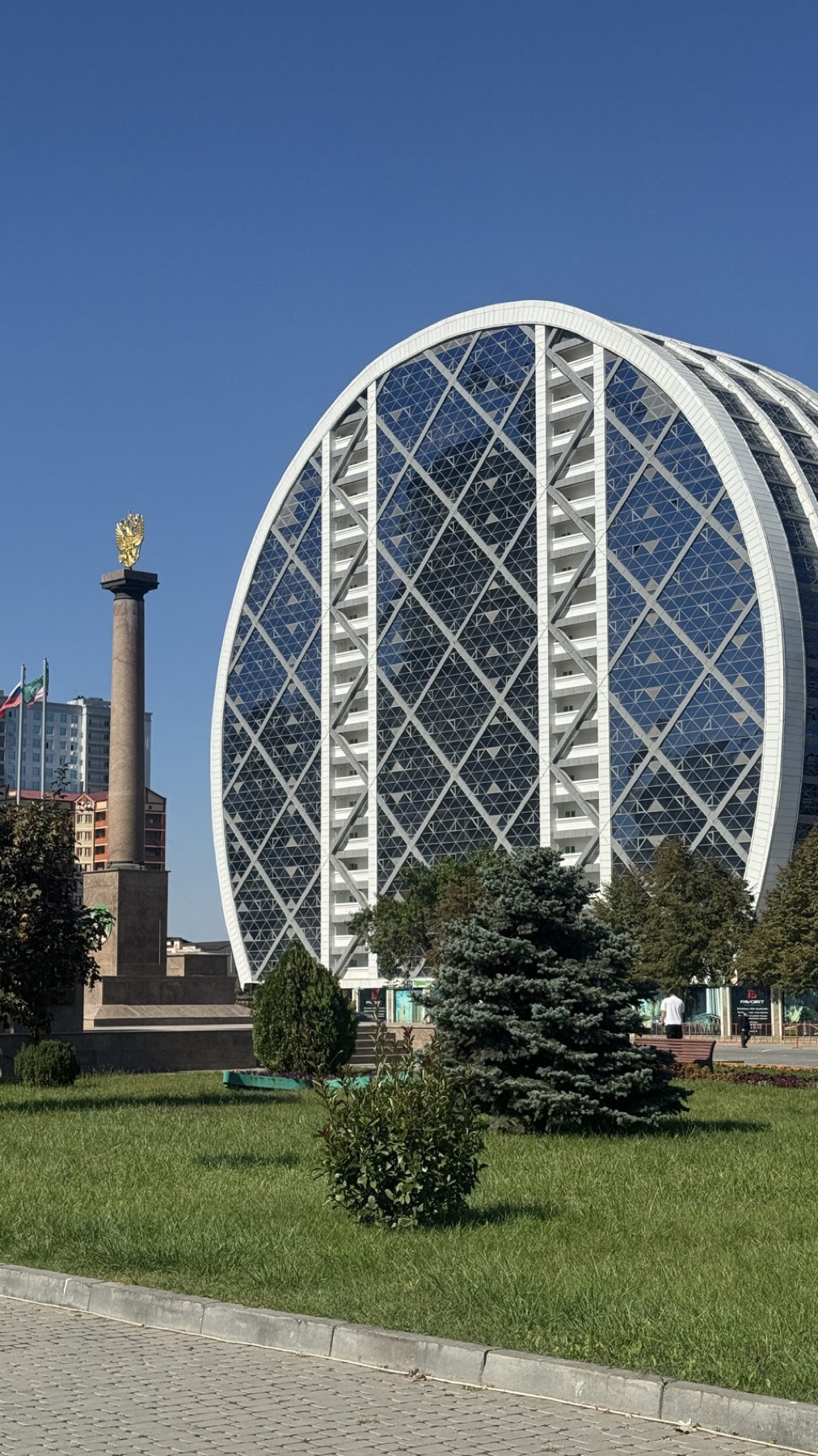 A modern oval glass building in central Grozny