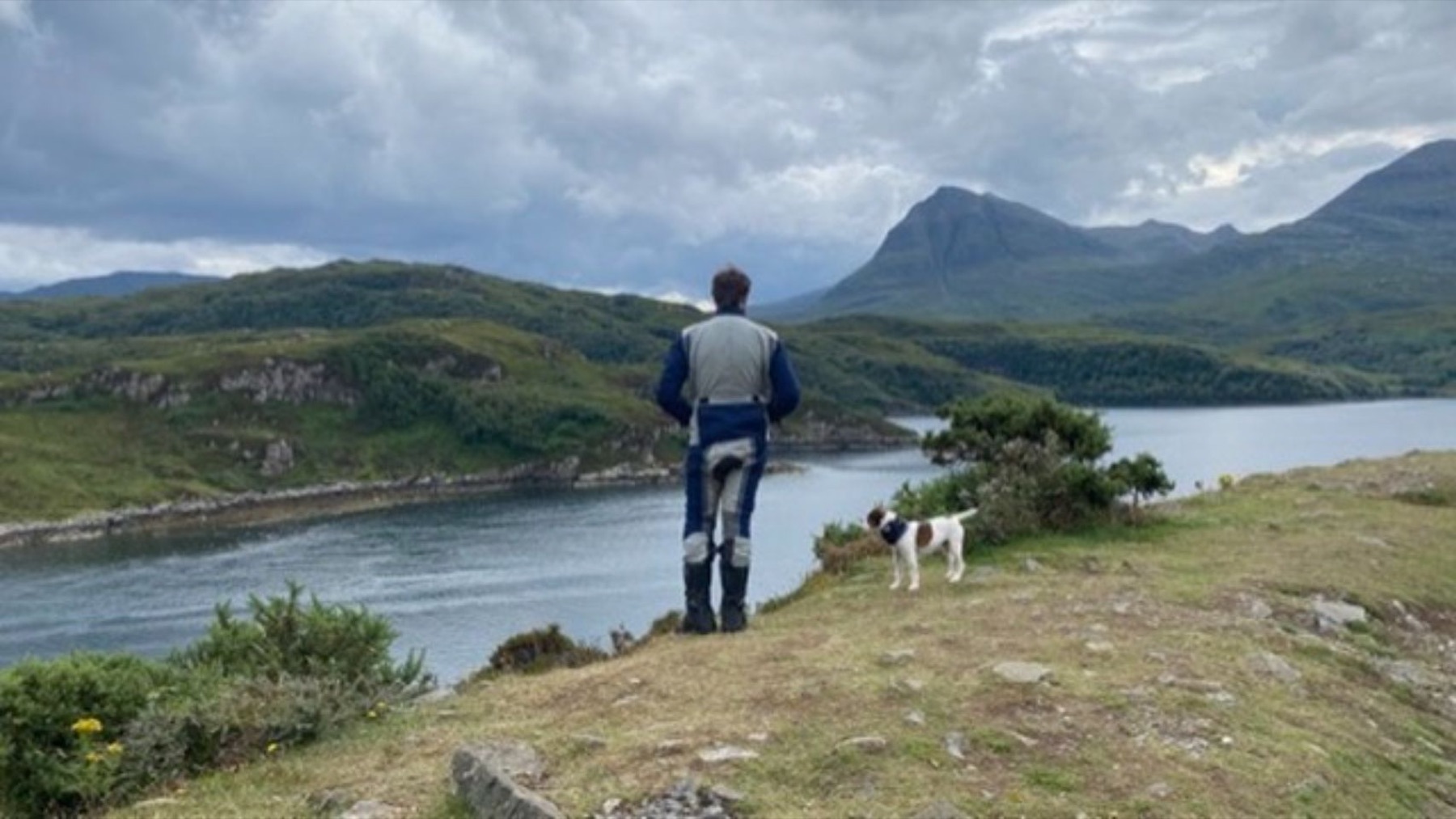 Rodrigo and Jacko looking out over a sea loch towards a mountain
