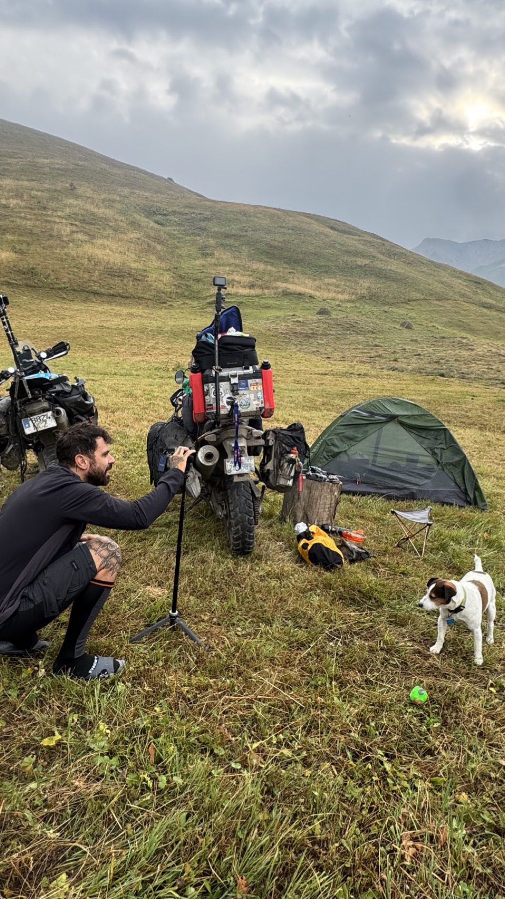 The tent and motorcycle pitched high in the mountains