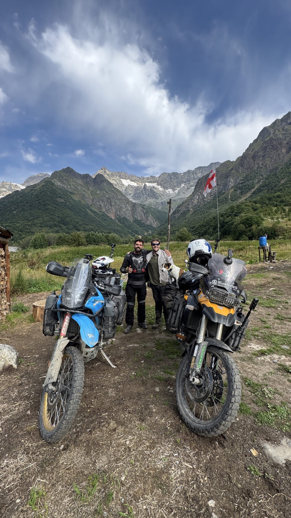 Two loaded motorcycles on a mountain track
