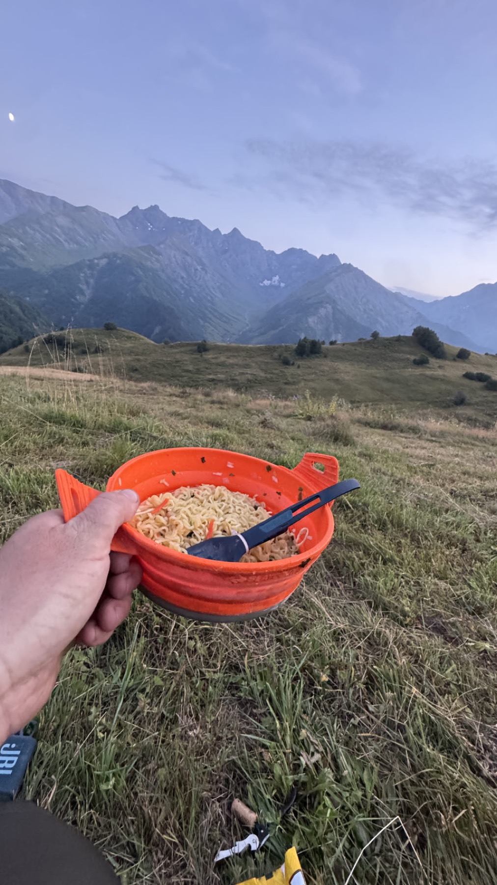 A bowl held up against the mountains