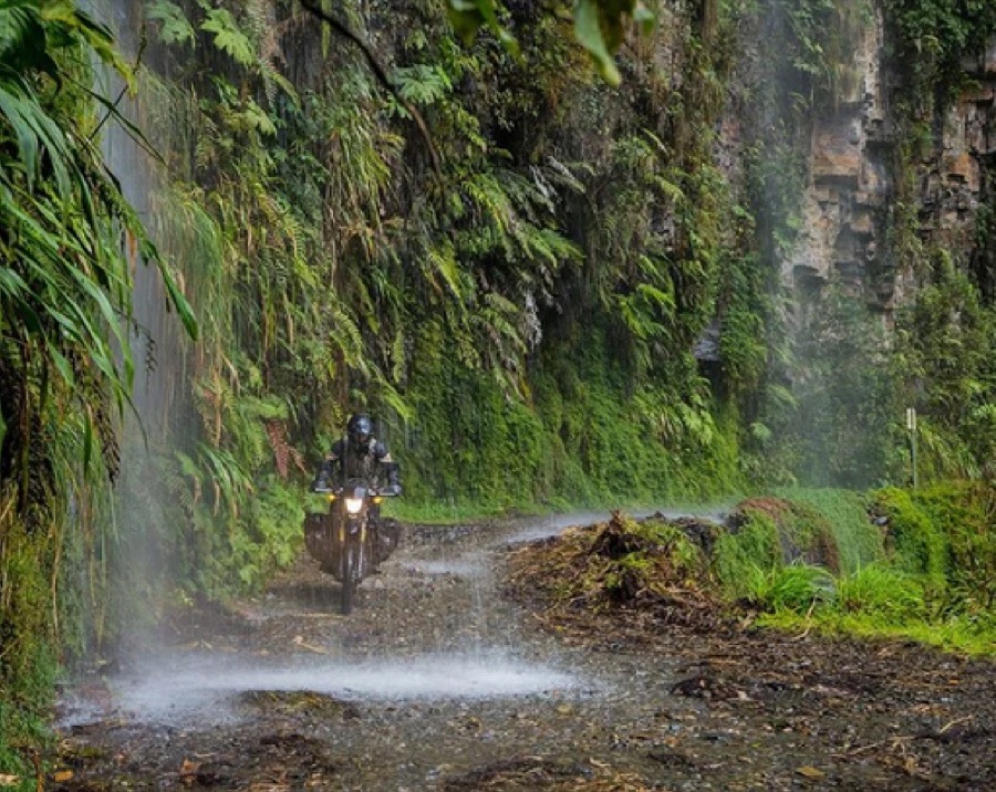 A motorcycle on a wet jungle road in the Bolivian Yungas