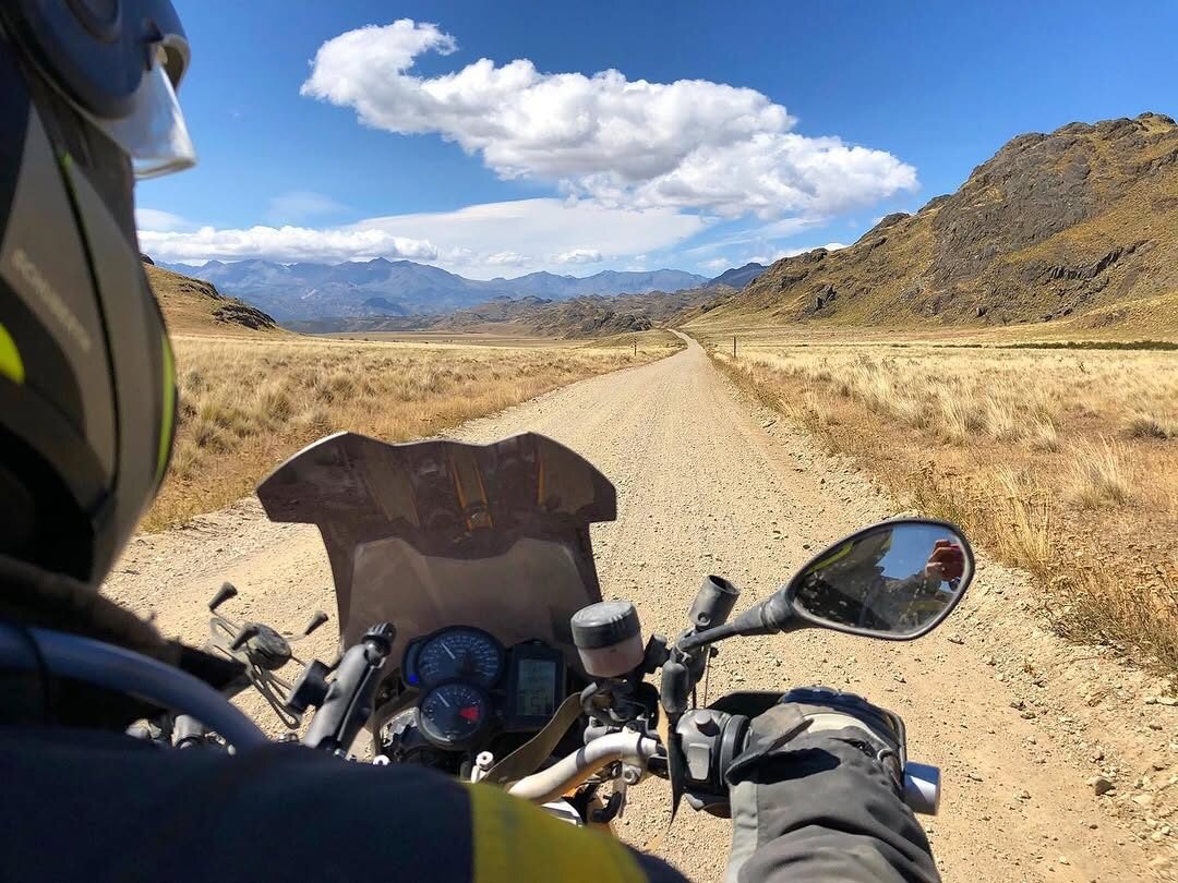 The view over an adventure motorcycle on a remote Patagonia gravel road