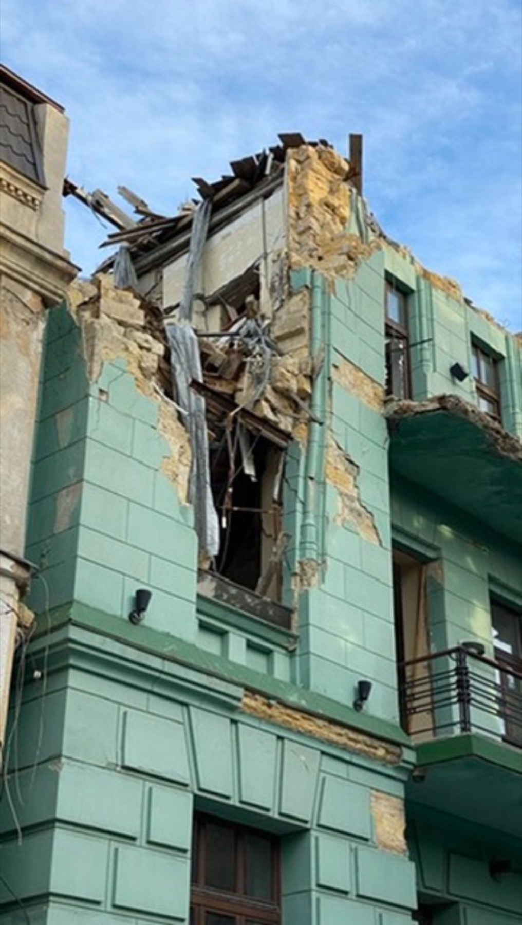 A residential building torn open by a strike