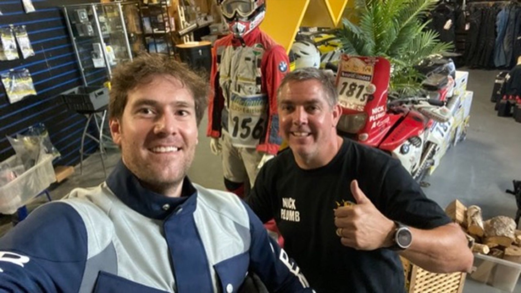 Rodrigo with one of the workshop crew, both giving a thumbs up