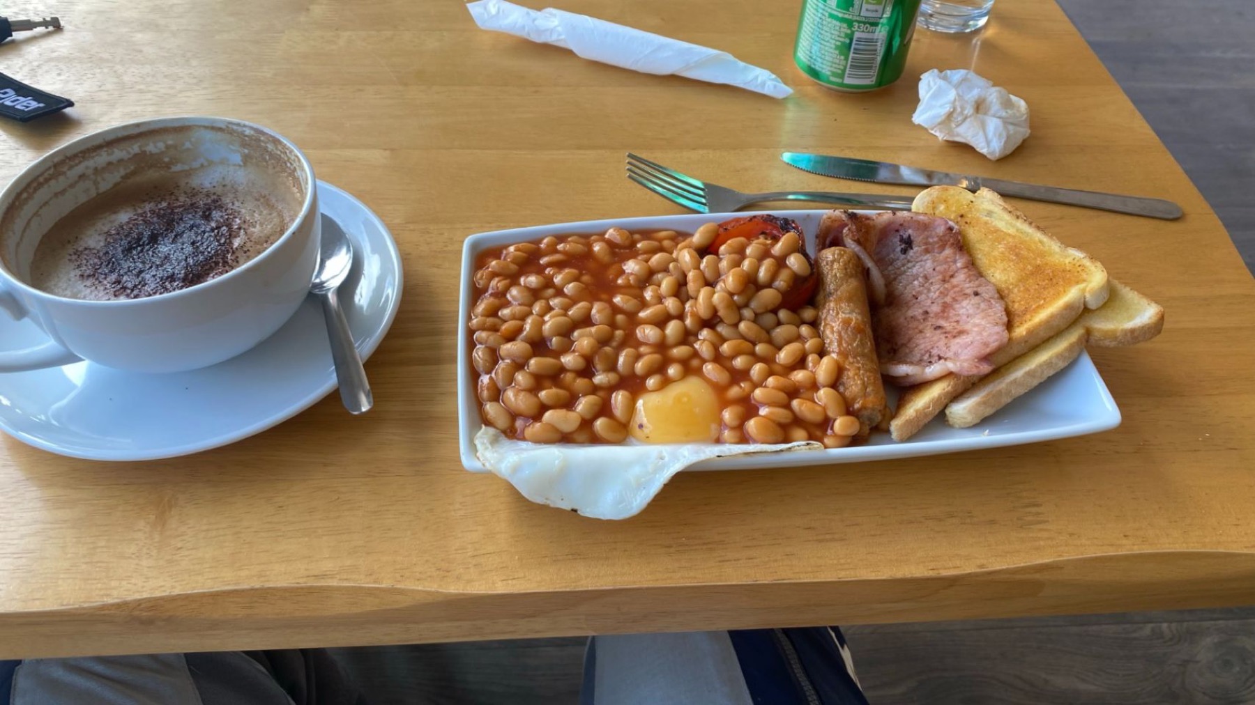 A full cooked breakfast with beans, toast and coffee
