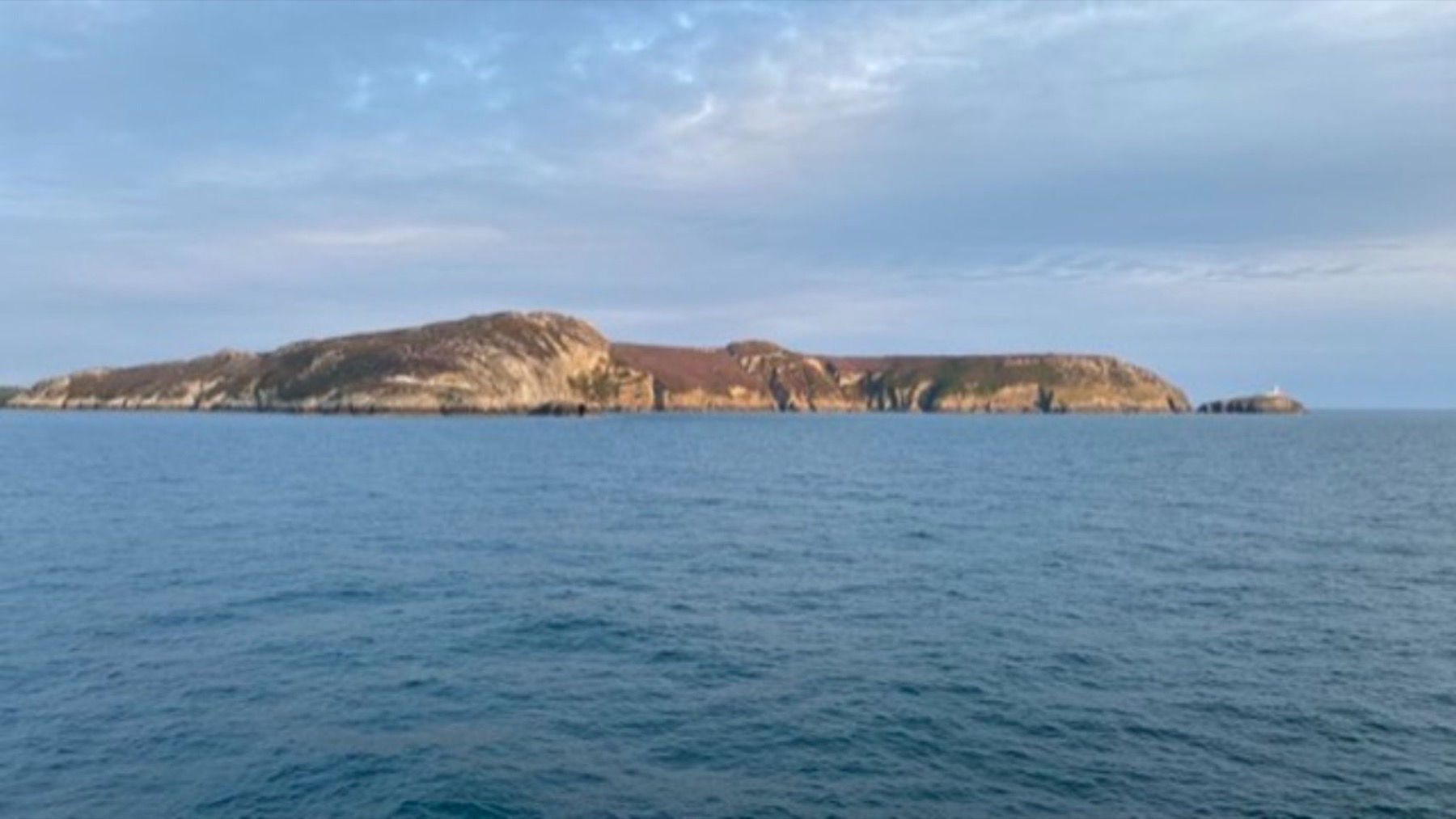 The sea and a headland seen from the coast at Holyhead